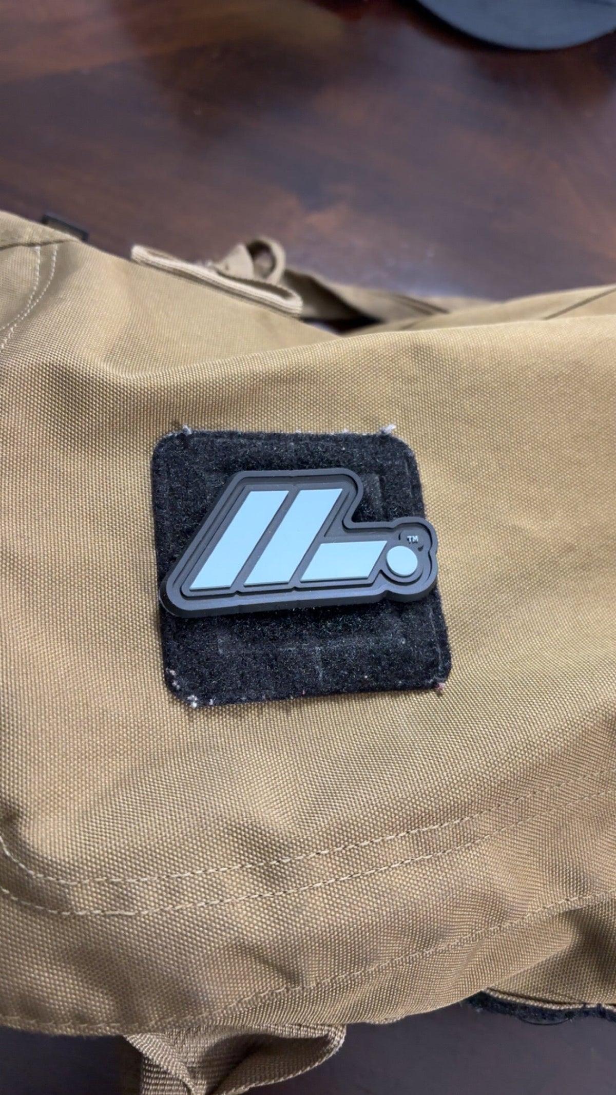 Actual LIFT. PVC patch attached to tan gear bag
