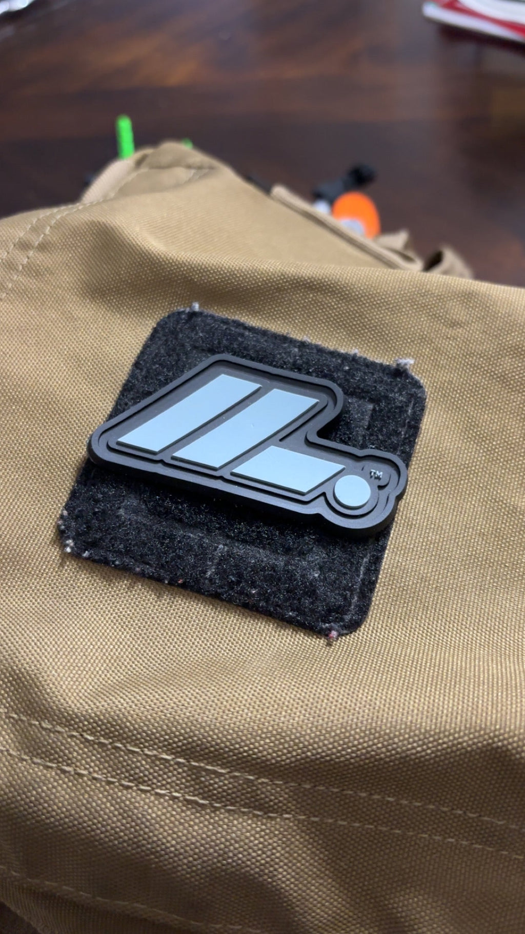 Actual LIFT. PVC patch on tan gear bag close-up