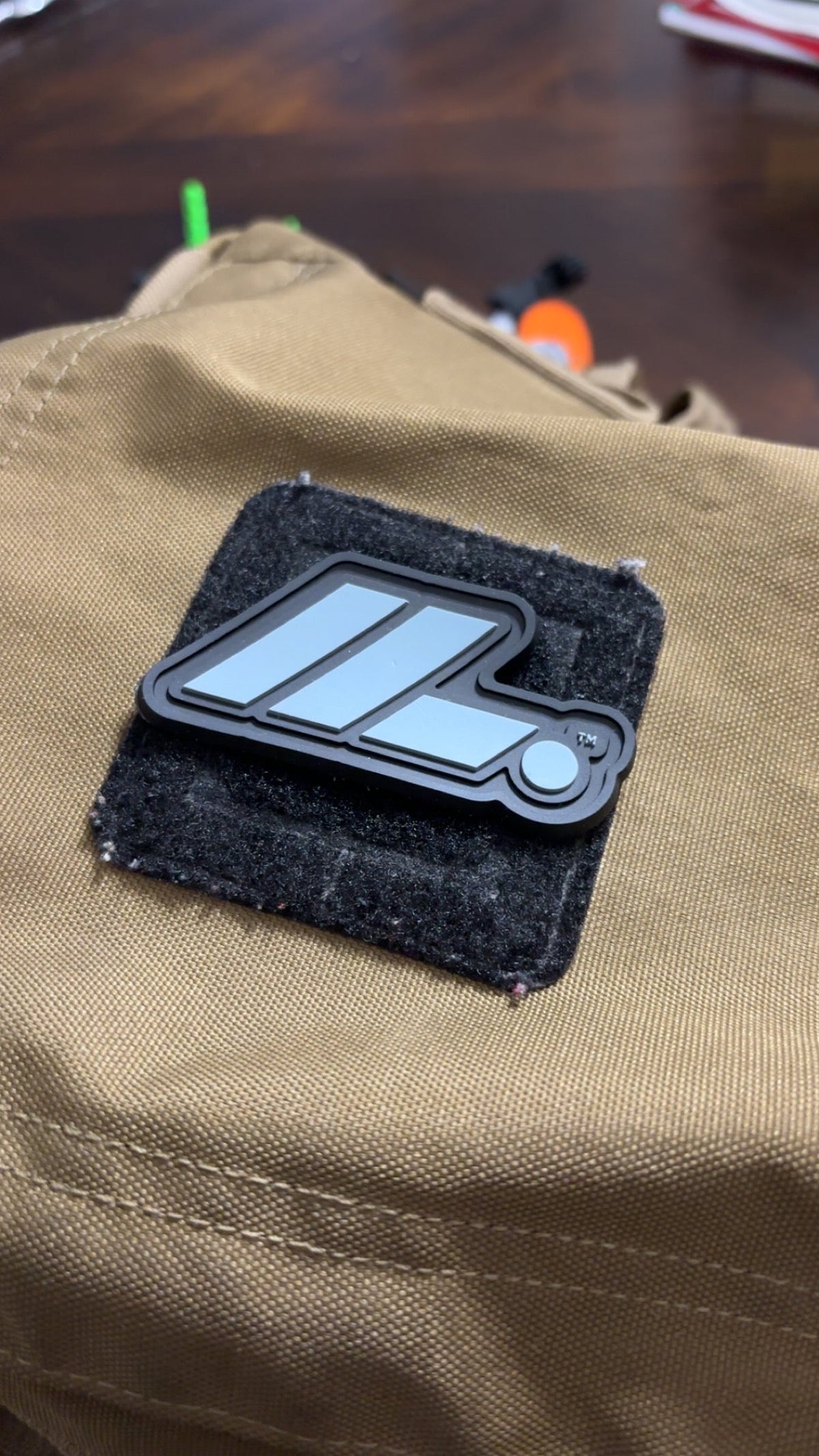 Actual LIFT. PVC patch on tan gear bag close-up